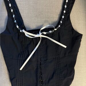 Black Corset Top With White Bow Detailing